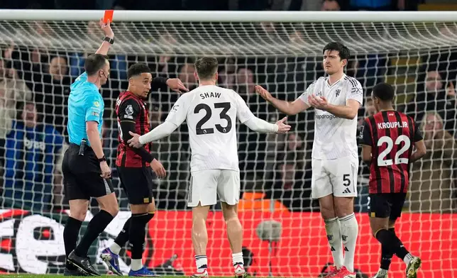 Manchester United's Harry Maguire (5) is sent off during a Premier League soccer match against AFC Bournemouth, Friday, March 20, 2026, in Bournemouth, England. (Andrew Matthews/PA via AP)
