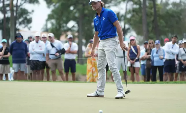 Austin Smotherman reacts to his putt on the eighth green during the third round of the Cognizant Classic golf tournament, Saturday, Feb. 28, 2026, in Palm Beach Gardens, Fla. (AP Photo/Marta Lavandier)