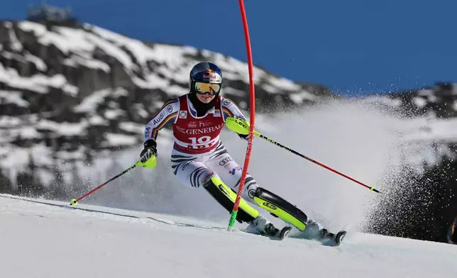 Germany's Emma Aicher speeds down the course, during an alpine ski, women's World Cup slalom, in Are, Sweden, Sunday, March 15, 2026. (AP Photo/Marco Trovati)