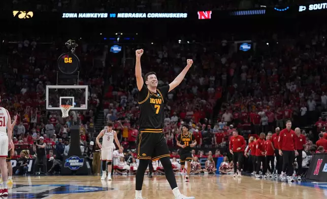 Iowa forward Alvaro Folgueiras (7)celebrates after defeating Nebraska in the Sweet 16 of the NCAA college basketball tournament Thursday, March 26, 2026, in Houston. (AP Photo/Eric Gay)