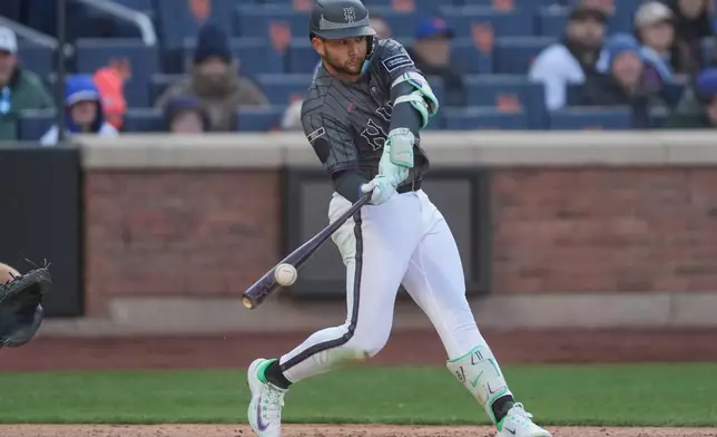 New York Mets shortstop Bo Bichette (19) hits a single during the fourth inning of a baseball game against the Pittsburgh Pirates , Saturday, March 28, 2026, in New York. (AP Photo/Yuki Iwamura)