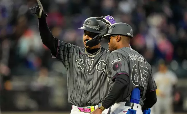 New York Mets third baseman Mark Vientos (27) celebrates after hitting a single during the tenth inning of a baseball game against the Pittsburgh Pirates, Saturday, March 28, 2026, in New York. (AP Photo/Yuki Iwamura)