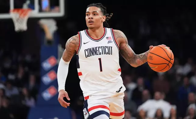UConn's Solo Ball (1) looks to pass during first half of an NCAA college basketball game against Xavier in the quarterfinals of the Big East basketball tournament Thursday, March 12, 2026, in New York. (AP Photo/Frank Franklin II)