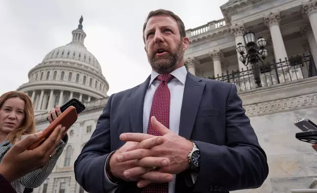 Sen. Markwayne Mullin, R-Okla., speaks with reporters on the steps at the Capitol in Washington, Thursday, March 5, 2026. (AP Photo/J. Scott Applewhite)