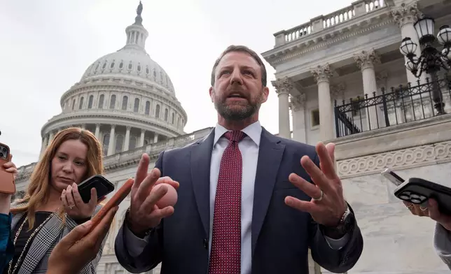Sen. Markwayne Mullin, R-Okla., speaks with reporters on the steps at the Capitol in Washington, Thursday, March 5, 2026. (AP Photo/J. Scott Applewhite)