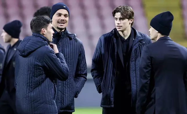Italy's Marco Palestra, right, walks on the pitch ahead of Tuesday's World Cup playoff final soccer match against Bosnia, at the Bilino Polje stadium, in Zenica, Bosnia, Monday, March 30, 2026. (AP Photo/Armin Durgut)
