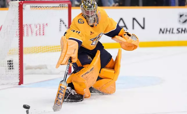 Nashville Predators goaltender Juuse Saros (74) defends the goal during the third period of an NHL hockey game against the San Jose Sharks, Tuesday, March 24, 2026, in Nashville, Tenn. (AP Photo/George Walker IV)