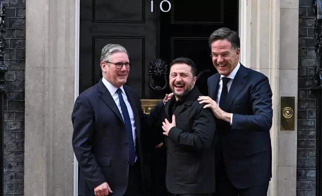 Britain's Prime Minister Keir Starmer Ukrainian President Volodymyr Zelenskyy and NATO Secretary General Mark Rutte leave 10 Downing Street after a meeting in London, Tuesday, March 17, 2026.(AP Photo/Thomas Krych)