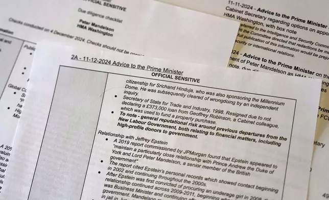A print out copy of the documents released by the British government are photographed in London, Wednesday, March 11, 2026, and show officials believed there was a "reputational risk" to appointing Peter Mandelson as the U.S. ambassador because of his relationship with convicted sex offender Jeffrey Epstein. (AP Photo/Frank Augstein)