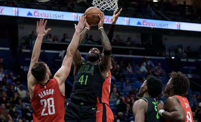 New Orleans Pelicans guard Saddiq Bey (41) shoots against Houston Rockets center Alperen Sengun (28) during the second half of an NBA basketball game in New Orleans, Sunday, March 29, 2026. (AP Photo/Matthew Hinton)