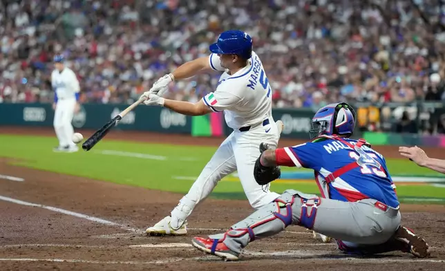 Italy's Jakob Marsee singles during the second inning of a World Baseball Classic quarterfinal game against Puerto Rico, Saturday, March 14, 2026, in Houston. (AP Photo/Karen Warren)