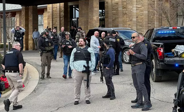 Law enforcement respond to a call at Temple Israel synagogue, Thursday, March 12, 2026 in West Bloomfield Township, Mich. (AP Photo/Corey Williams)
