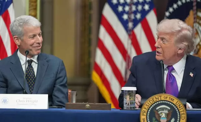President Donald Trump looks at Energy Secretary Chris Wright as he speaks during an event about the Ratepayer Protection Pledge, in the Indian Treaty Room of the Eisenhower Executive Office Building on the White House complex, Wednesday, March 4, 2026, in Washington. (AP Photo/Jacquelyn Martin)
