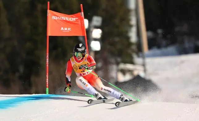 Switzerland's Camille Rast speeds down the course during a women's World Cup giant slalom, in Are, Sweden, Saturday, March 14, 2026. (AP Photo/Marco Trovati)