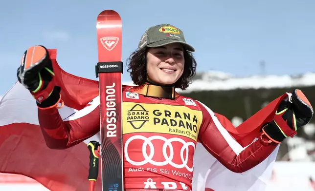 Austria's Julia Scheib celebrates winning a women's World Cup giant slalom, in Are, Sweden, Saturday, March 14, 2026. (AP Photo/Gabriele Facciotti)