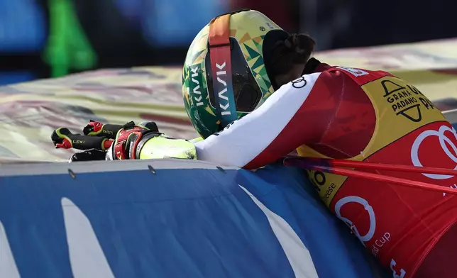 Austria's Julia Scheib celebrates winning a women's World Cup giant slalom, in Are, Sweden, Saturday, March 14, 2026. (AP Photo/Gabriele Facciotti)