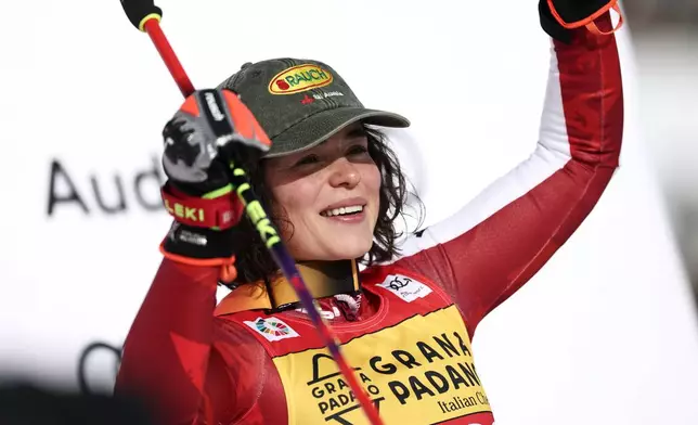 Austria's Julia Scheib celebrates winning a women's World Cup giant slalom, in Are, Sweden, Saturday, March 14, 2026. (AP Photo/Gabriele Facciotti)