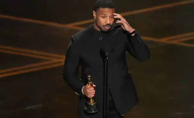 Michael B. Jordan accepts the award for actor in a leading role for "Sinners" during the Oscars on Sunday, March 15, 2026, at the Dolby Theatre in Los Angeles. (AP Photo/Chris Pizzello)