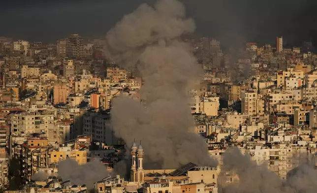Smoke rises from Israeli airstrikes in Dahiyeh, a southern suburb of Beirut, Lebanon, Tuesday, March 3, 2026. (AP Photo/Hussein Malla)