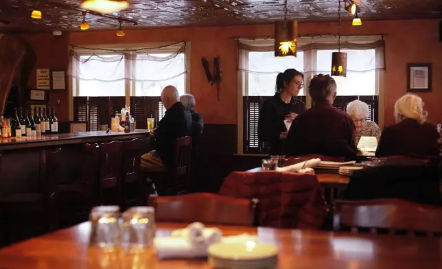 Diners eat at Barkeaters Restaurant on Tuesday, March 3, 2026 in Shelburne, Vt. (AP Photo/Amanda Swinhart)