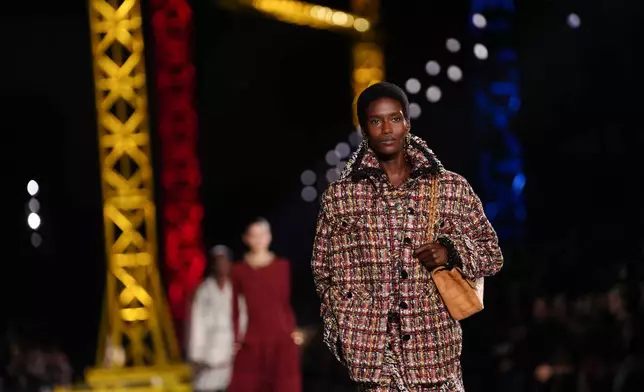 A model wears a creation as part of the Chanel Fall/Winter 2026-2027 Women's collection presented in Paris, Monday, March 9, 2026. (AP Photo/Aurelien Morissard)