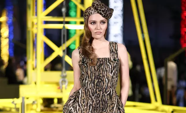 Lily-Rose Depp poses for photographers upon arrival for the Chanel Fall/Winter 2026-2027 Women's collection presented in Paris, Monday, March 9, 2026. (AP Photo/Tom Nicholson)