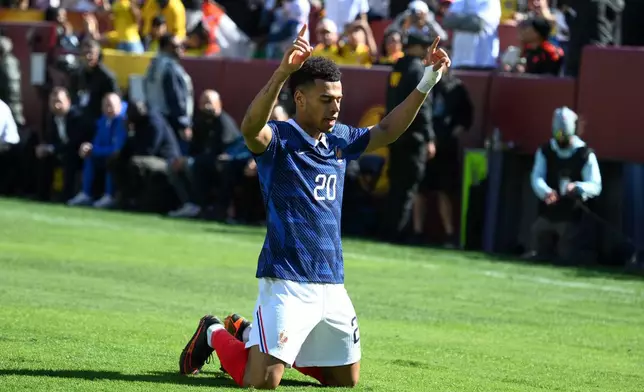France forward Désiré Doué (20) celebrates after scoring the opening goal during the international friendly soccer match between Colombia and France in Landover, Md., Sunday, March 29, 2026. (AP Photo/Nick Wass)
