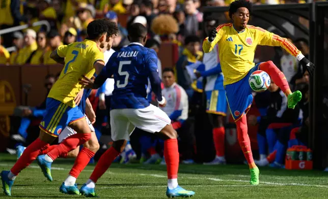 Colombia defender Johan Mojica (17) controls the ball during the international friendly soccer match between Colombia and France in Landover, Md., Sunday, March 29, 2026. (AP Photo/Nick Wass)