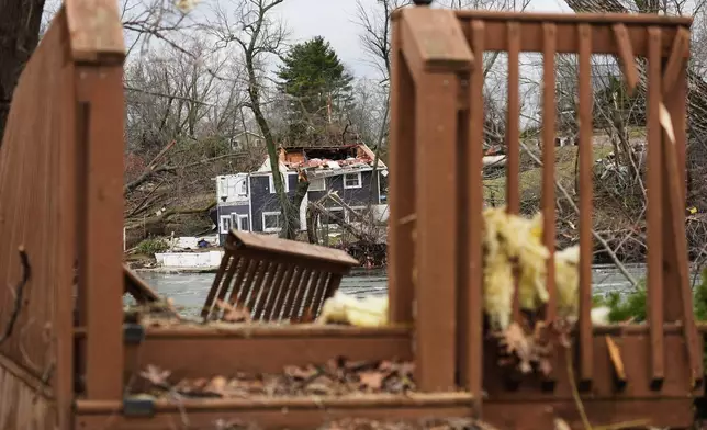 A storm-damaged home sits amid debris in the aftermath of a powerful storm that ripped through the area a day earlier, in Union City Mich., Saturday, March 7, 2026. (AP Photo/Nam Y. Huh)