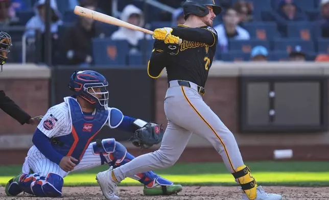 Pittsburgh Pirates' Ryan O'Hearn hits an RBI single during the 10th inning of a baseball game against the New York Mets, Sunday, March 29, 2026, in New York. (AP Photo/Seth Wenig)