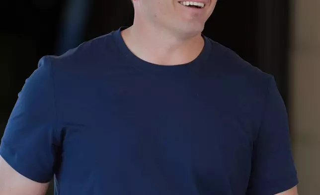 Seattle Seahawks head coach Mike Macdonald smiles as he walks after attending a session at the NFL football annual meetings, Monday, March 30, 2026, in Phoenix. (AP Photo/Ross D. Franklin)