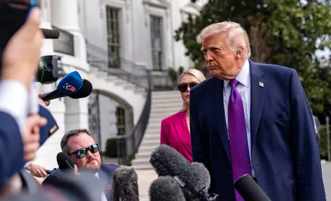 President Donald Trump speaks with reporters before departing on Marine One from the South Lawn of the White House, Wednesday, March 11, 2026, in Washington. (AP Photo/Alex Brandon)