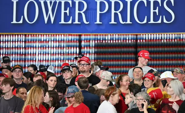 People arrive before President Donald Trump speaks at Verst Logistics in Hebron, Ky., Wednesday, March 11, 2026. (AP Photo/Jon Cherry)