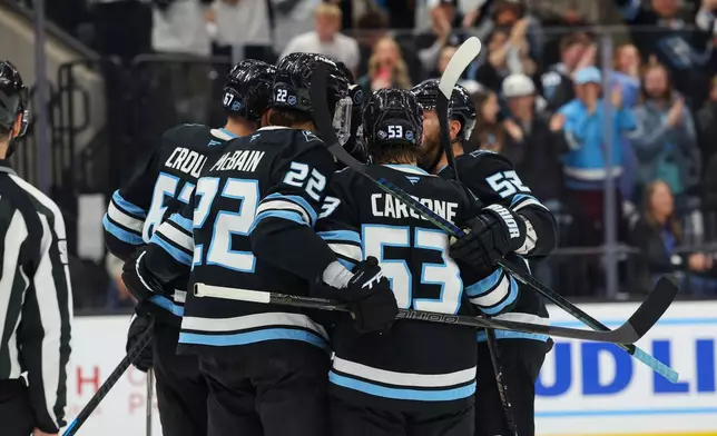 Utah Mammoth celebrate the goal against the Edmonton Oilers during the second period of an NHL hockey game, Tuesday, March 24, 2026, in Salt Lake City. (AP Photo/Melissa Majchrzak)