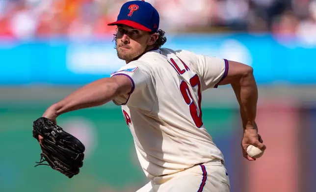 Philadelphia Phillies stating pitcher Aaron Nola delivers during the first inning of a baseball game against the Texas Rangers, Saturday, March 28, 2026, in Philadelphia. (AP Photo/Chris Szagola)