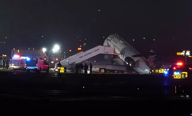 An Air Canada Jet sits on the runway at LaGuardia Airport, Monday, March 23, 2026, after colliding with a Port Authority vehicle in New York. (AP Photo/Ryan Murphy)