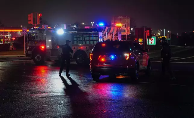 Firetrucks lineup outside LaGuardia Airport, Monday, March 23, 2026, in New York, after an Air Canada Jet collided with a Port Authority vehicle on a runway. (AP Photo/Ryan Murphy)