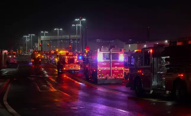 Firetrucks lineup outside LaGuardia Airport, Monday, March 23, 2026, in New York, after an Air Canada Jet collided with a Port Authority vehicle on a runway. (AP Photo/Ryan Murphy)