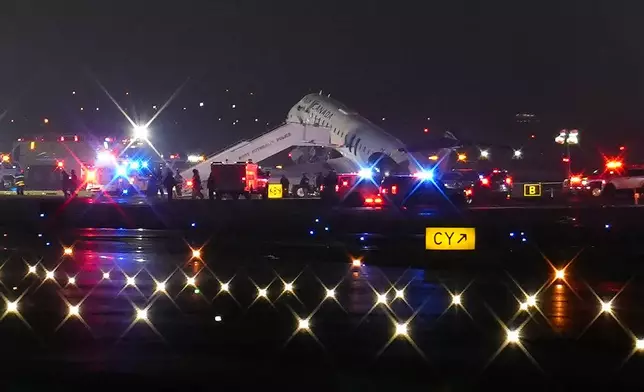 An Air Canada Jet sits on the runway at LaGuardia Airport, Monday, March 23, 2026, after colliding with a Port Authority vehicle in New York. (AP Photo/Ryan Murphy)