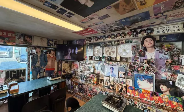 Walls are decorated by pictures of K-pop band BTS at Yoojung Sikdang, a restaurant in Seoul where BTS members frequently ate during their trainee days, in Seoul, South Korea, Friday, March 20, 2026. (AP Photo/Juwon Park)