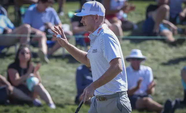 Brandt Snedeker waves to the crowd after his par putt on the 17th hole during the third round of the Valspar Championship golf tournament, Saturday, March 21, 2026, in Palm Harbor, Fla. (Chris Urso/Tampa Bay Times via AP)