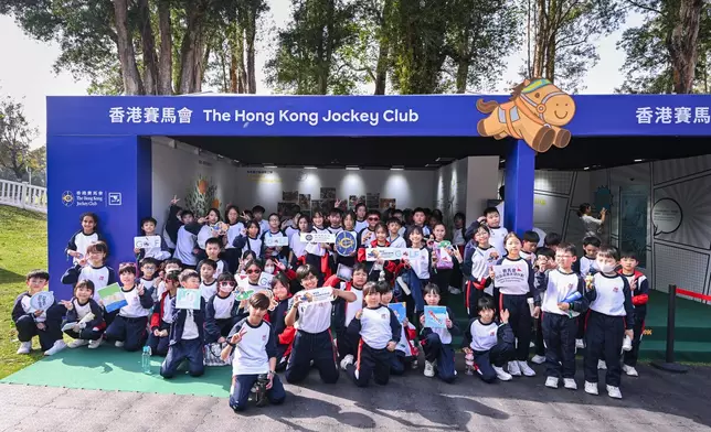 Beneficiaries of the Jockey Club Community Golf Programme and visitors at the Jockey Club booth.