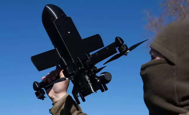An instructor from the Ukrainian company General Cherry demonstrates the operation of an anti-air interceptor drone designed to destroy Russian attack drones in Kyiv region, Wednesday, March 11, 2026. (AP Photo/Efrem Lukatsky)