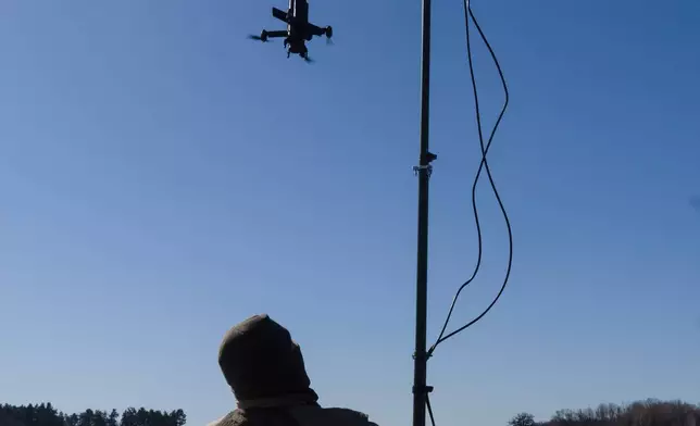 An instructor from the Ukrainian company General Cherry demonstrates the operation of an anti-air interceptor drone designed to destroy Russian attack drones in Kyiv region, Wednesday, March 11, 2026. (AP Photo/Efrem Lukatsky)