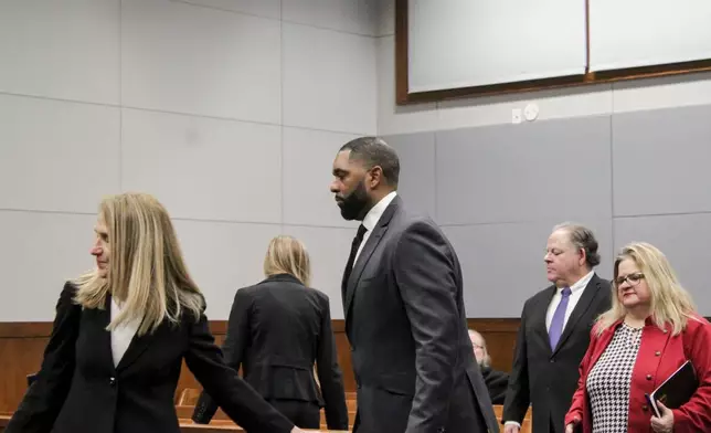 Sherrone Moore appears with his attorney, Ellen Michaels arrive for a hearing, Friday, March 6 2026, at Washtenaw County 14A-1 District in Ann Arbor, Mich. (Jordyn Pair/Ann Arbor News via AP)