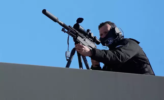 Security forces take position ahead of the arrival of Pope Leo XIV at Monaco Heliport in Monte Carlo, Monaco, Saturday, March 28, 2026. (AP Photo/Gregorio Borgia, Pool)