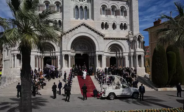 Pope Leo XIV leaves after meeting with the local Catholic community inside Monaco Cathedral in Monaco-Ville, Monaco, Saturday, March 28, 2026. (AP Photo/Laurent Cipriani)