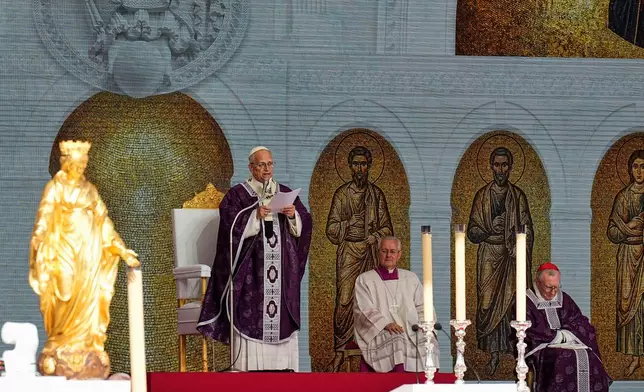 Pope Leo XIV delivers his homily during a mass at Stade Louis II in Fontvieille, Monaco, Saturday, March 28, 2026. (AP Photo/Laurent Cipriani)