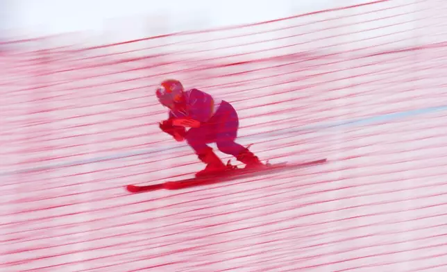 Ammi Hondo, of Japan, competes in her first run of the alpine skiing women's giant slalom standing at the 2026 Winter Paralympics, in Cortina d'Ampezzo, Italy, Thursday, March 12, 2026. (AP Photo/Emilio Morenatti)