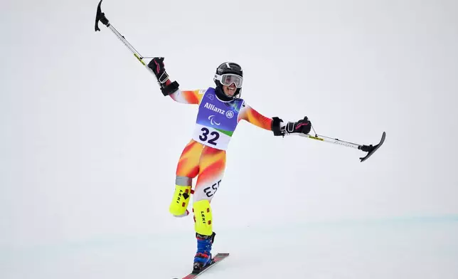 Maria Martin-Granizo, of Spain, crosses the finish line on her second run of the alpine skiing women's giant slalom standing at the 2026 Winter Paralympics, in Cortina d'Ampezzo, Italy, Saturday, March 14, 2026. (AP Photo/Evgeniy Maloletka)